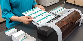 Business cards being cut